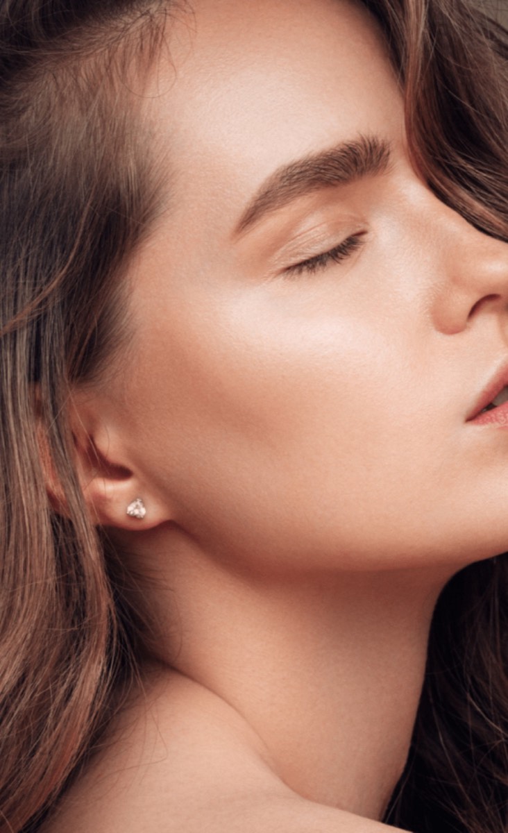 Profile of a woman with eyes closed and smooth, rejuvenated skin